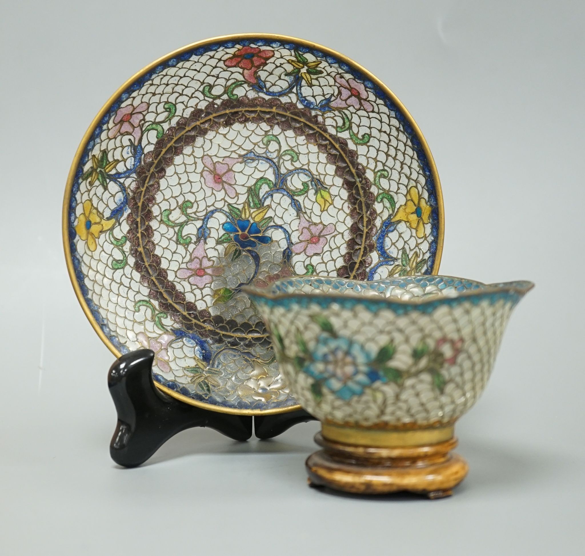 A Chinese plique a jour enamel cup and saucer 13cm diameter